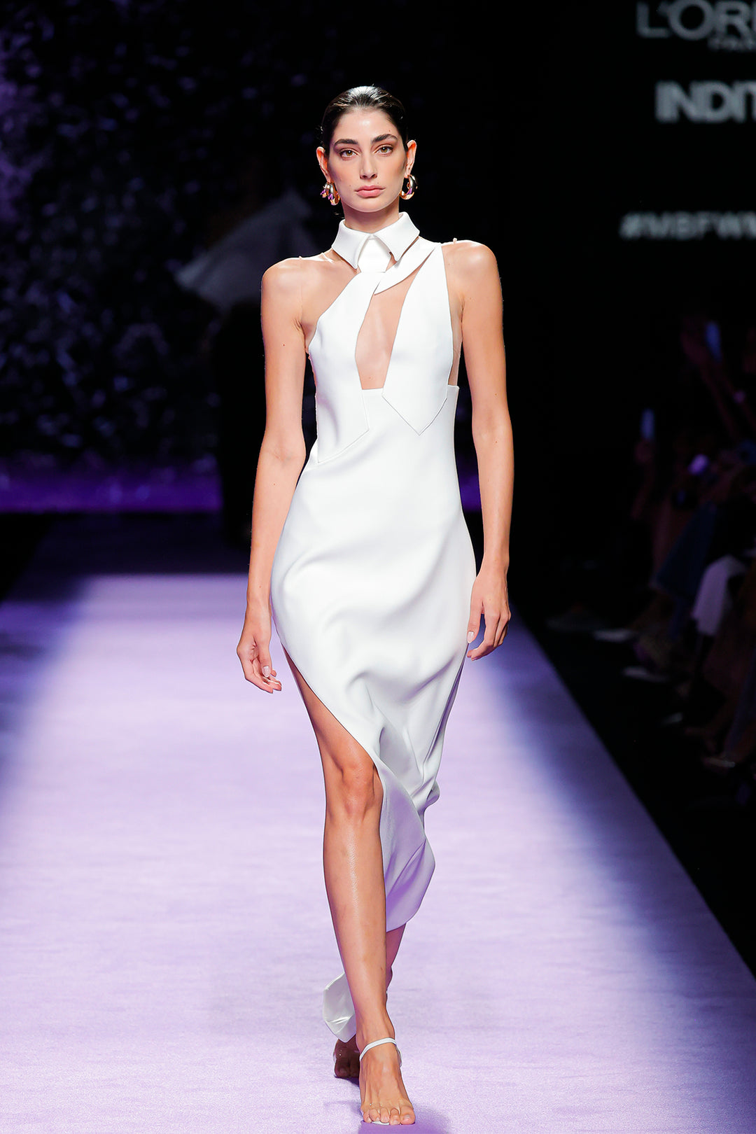 asymmetric neckline dress Xscape Petite Front Slit Evening Gown - Plum Sophisticated asymmetric neckline creates modern elegance Romantic flutter sleeves offer graceful arm coverage Stunning beaded embellishments along neckline and bodice Ruched bodice creates a slimming Long Asymmetrical Neckline Beaded Formal