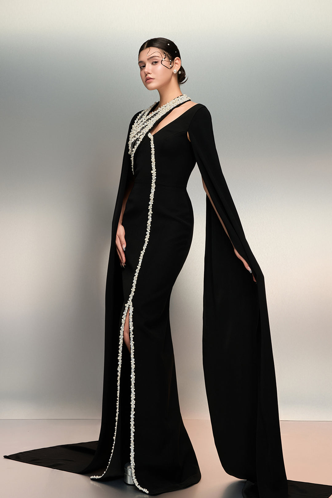 Cape-Driven Column Dress