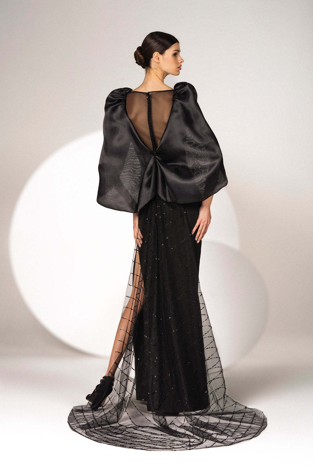 Black crepe dress with an Organza cape and tulle train