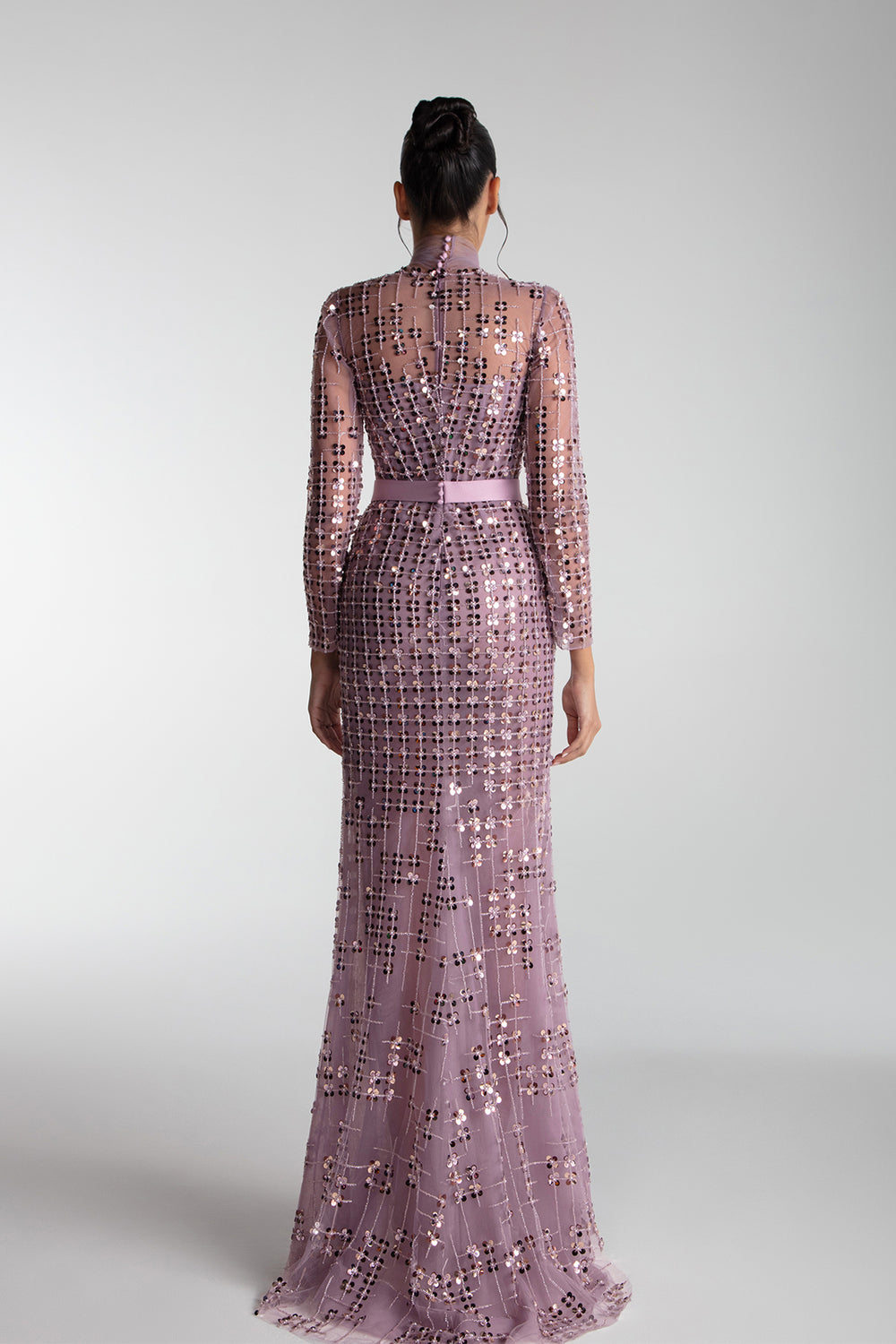 geometric embroidered dress A luxurious burgundy dress adorned with geometric embroidery