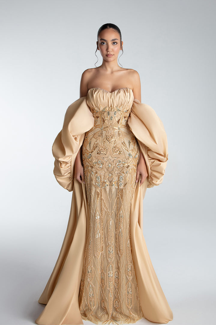 Strapless Gown With Draped Bodice And Sculptural Cape