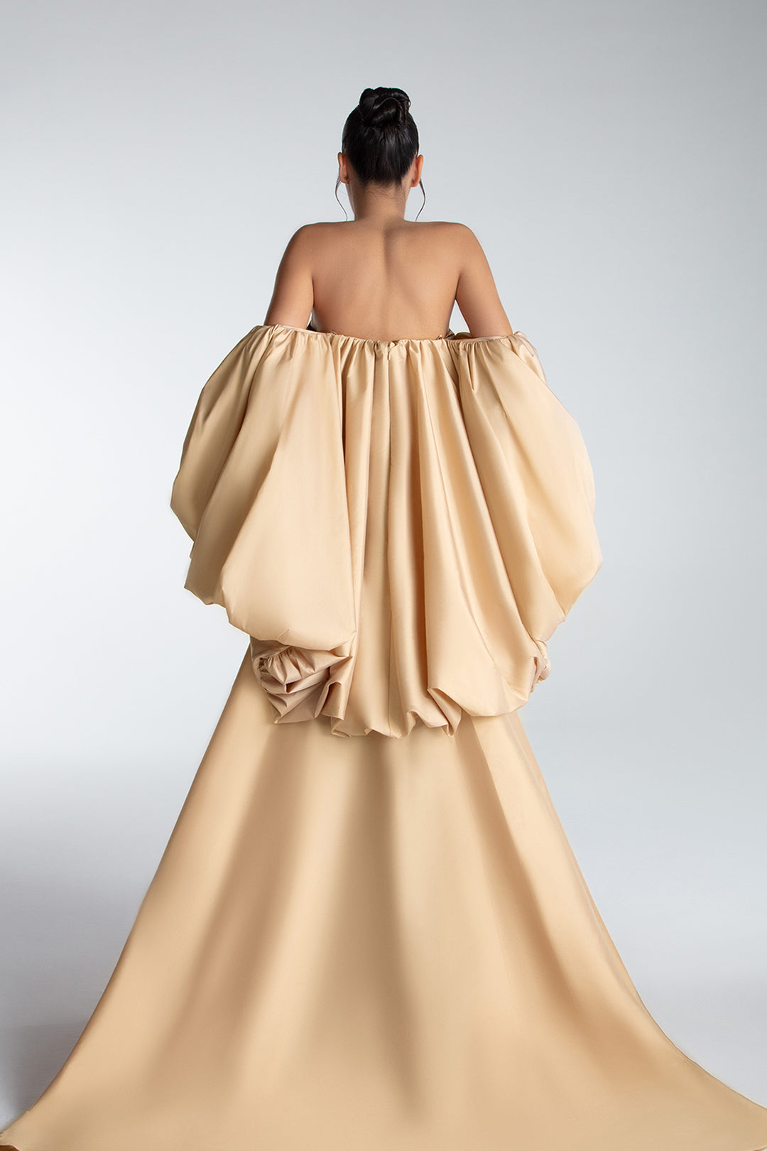Strapless Gown With Draped Bodice And Sculptural Cape